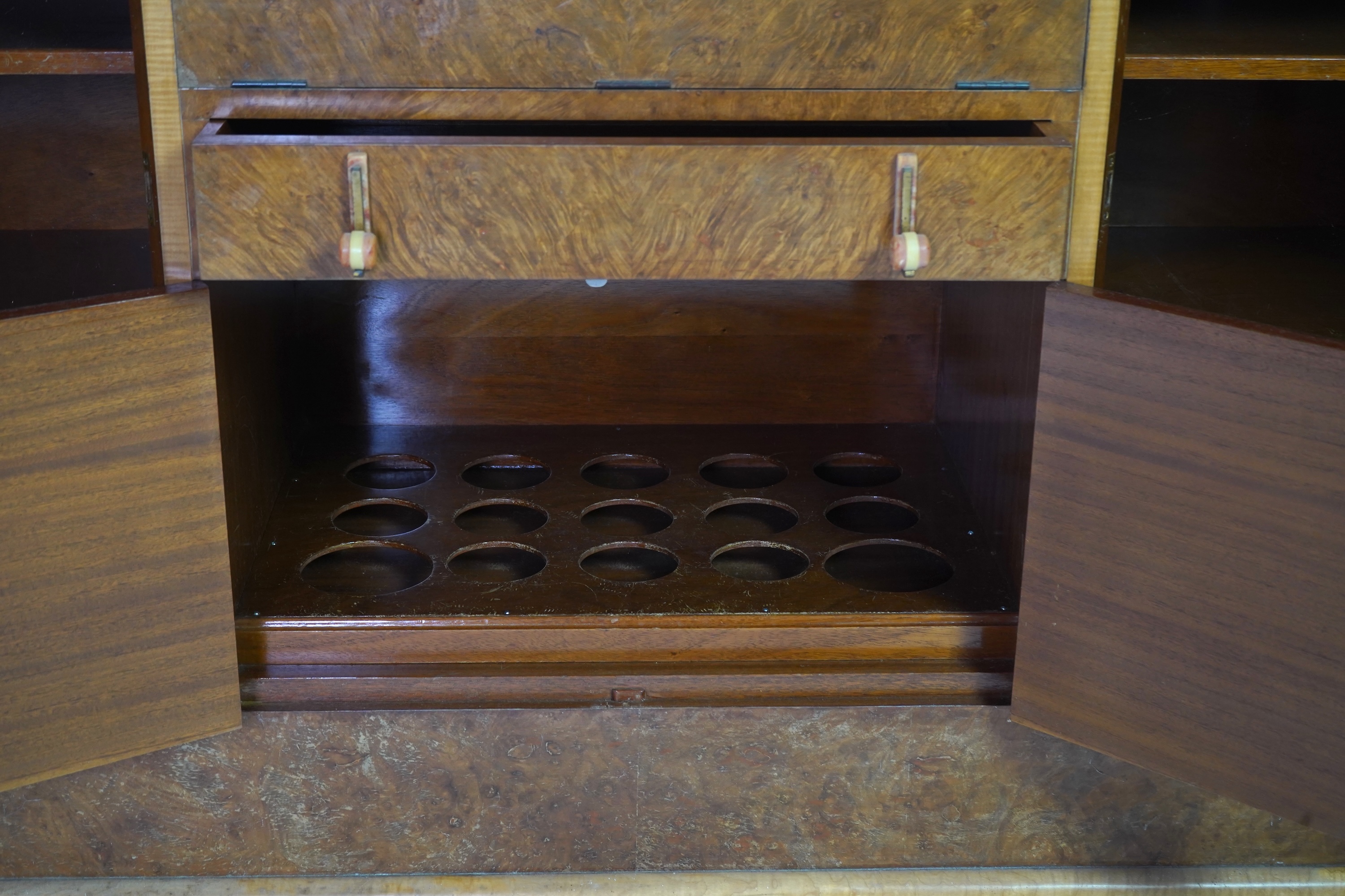 Attributed to Harry and Lou Epstein: An Art Deco burr walnut dining suite